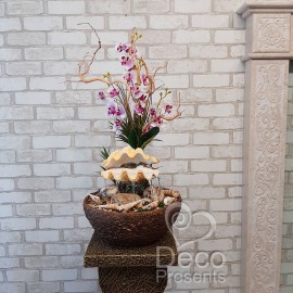 Настільний фонтан з квітами орхідеї